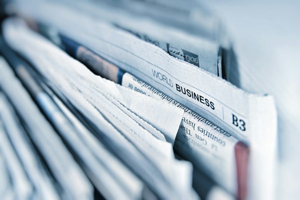 Stack of business newspapers