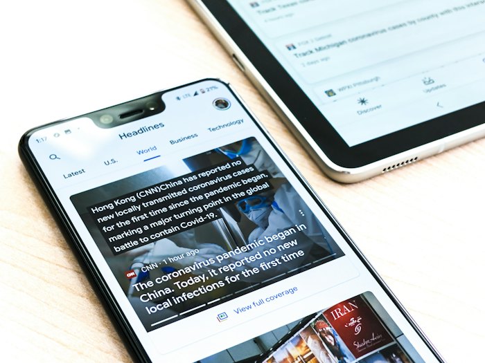 News article open on a tablet