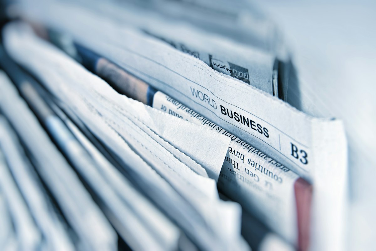 Business newspaper open on a desk