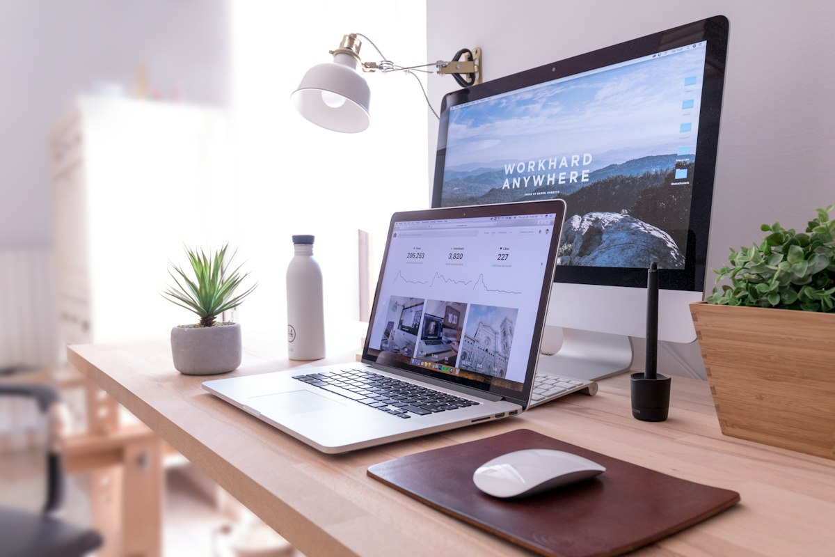 Laptop and monitor on a clean modern desk