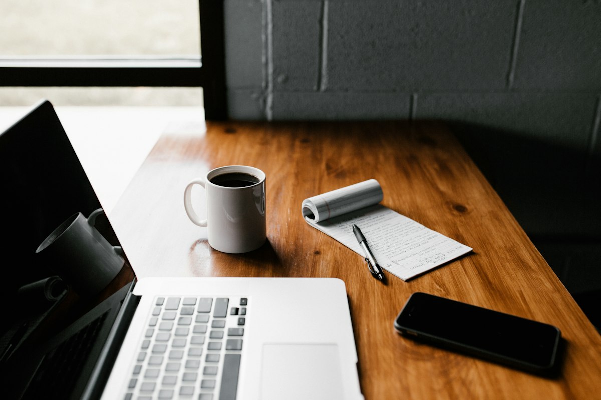 Writer drafting an article on a laptop